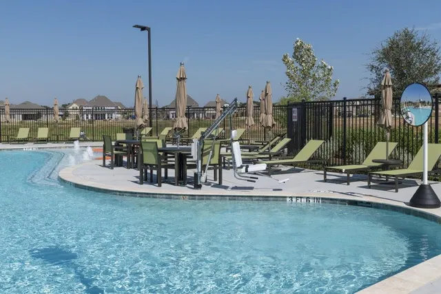 a view of a water with a sitting area and furniture