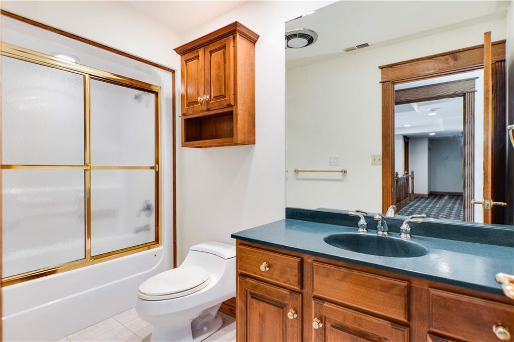 9290 Peebles Road Allison Park, PA 15101 - Photo 15 of 25 a bathroom with a sink a toilet and a mirror