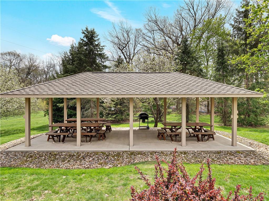 9290 Peebles Road Allison Park, PA 15101 - Photo 22 of 25 a view of a patio with table and chairs under an umbrella