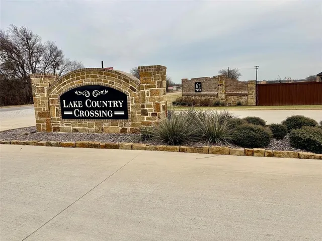 a view of a street with a building in the background