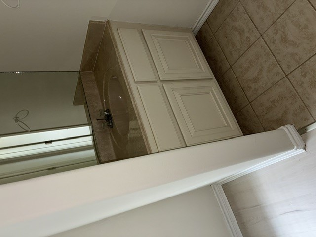 404 West 24th Street Bryan, TX 77803 - Photo 18 of 22 a bathroom with a sink and vanity