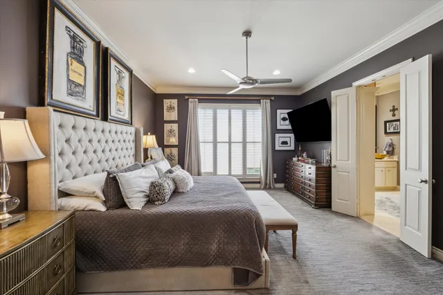 a bedroom with a bed couch and a window