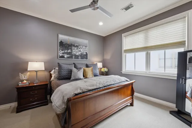 a bed room with a bed and a window