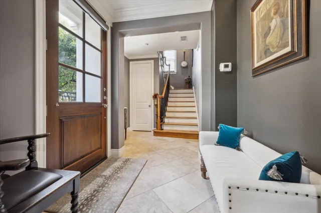 a view of a bedroom with furniture and windows