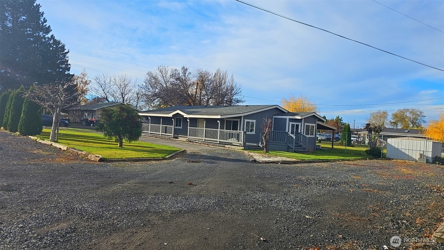 614 South Andes Road Othello, WA 99344 - Photo 4 of 6 a view of pool with umbrella and trees in the background