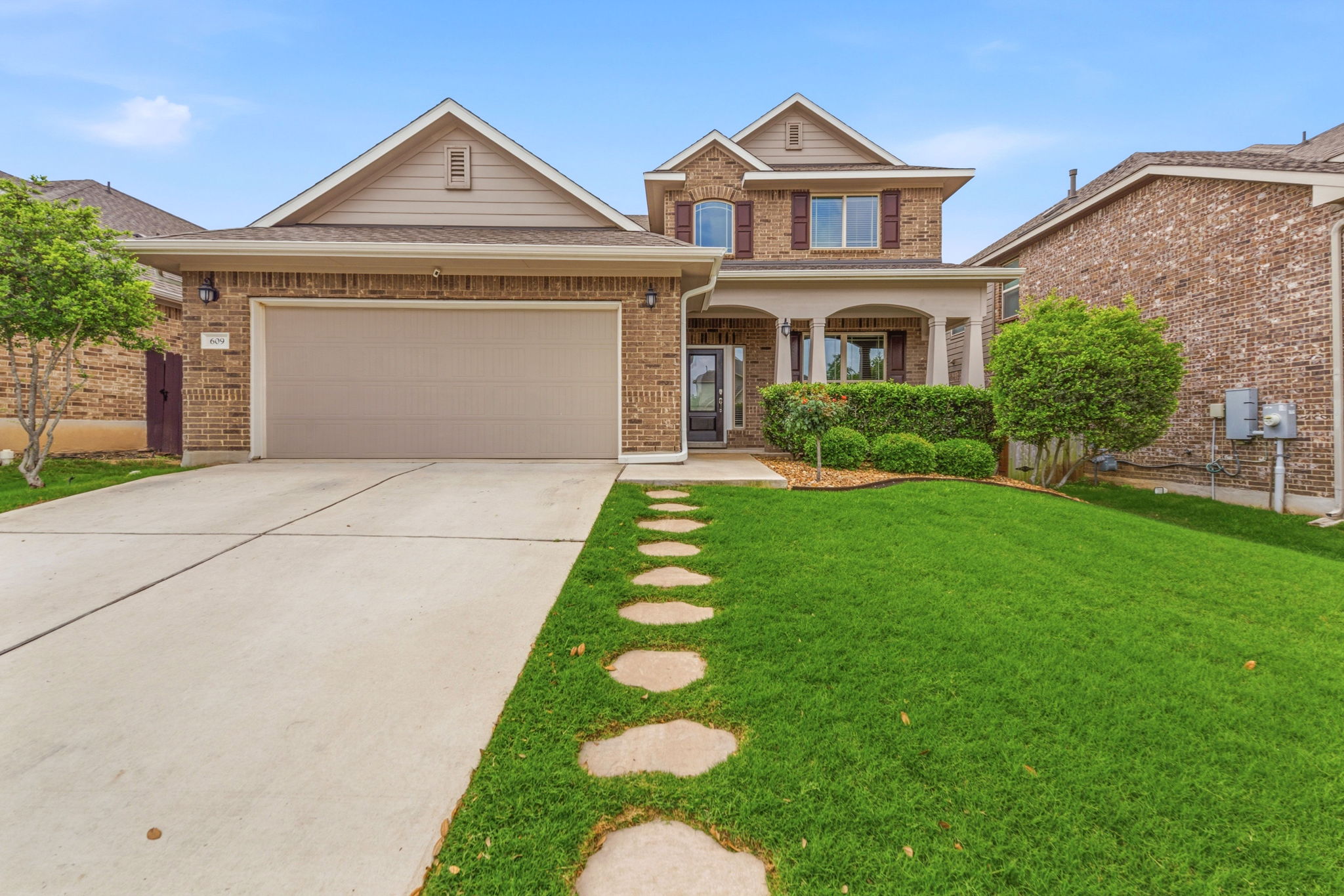 609 Allende Bend, Unit 130 Austin, TX 78748 - Photo 1 of 33 a front view of a house with a yard