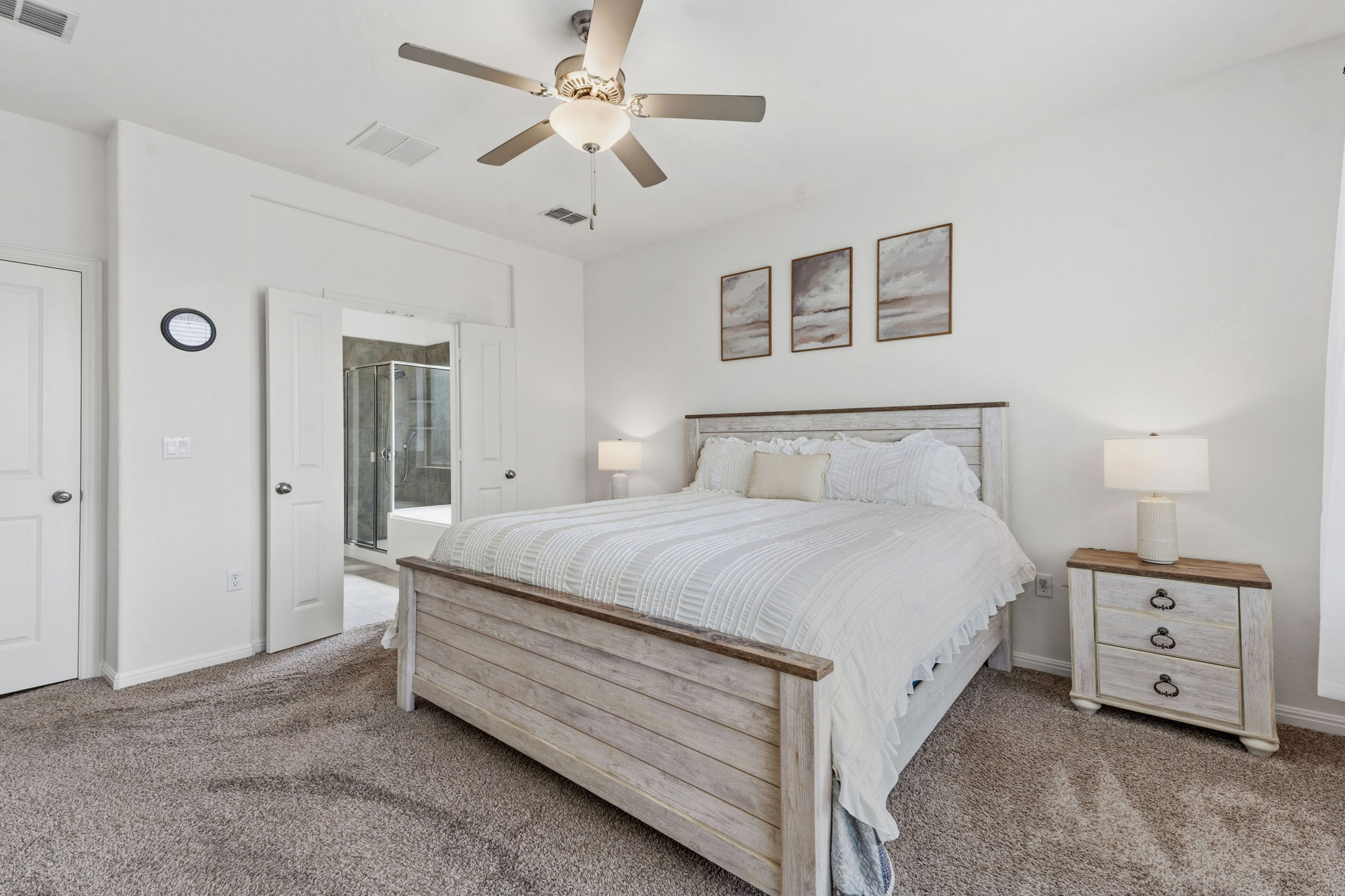 609 Allende Bend, Unit 130 Austin, TX 78748 - Photo 17 of 33 a spacious bedroom with a bed and a chandelier