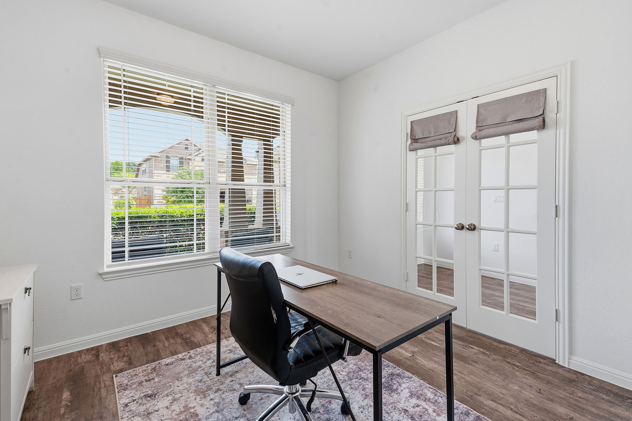 609 Allende Bend, Unit 130 Austin, TX 78748 - Photo 23 of 33 a view of a workspace with furniture and a window
