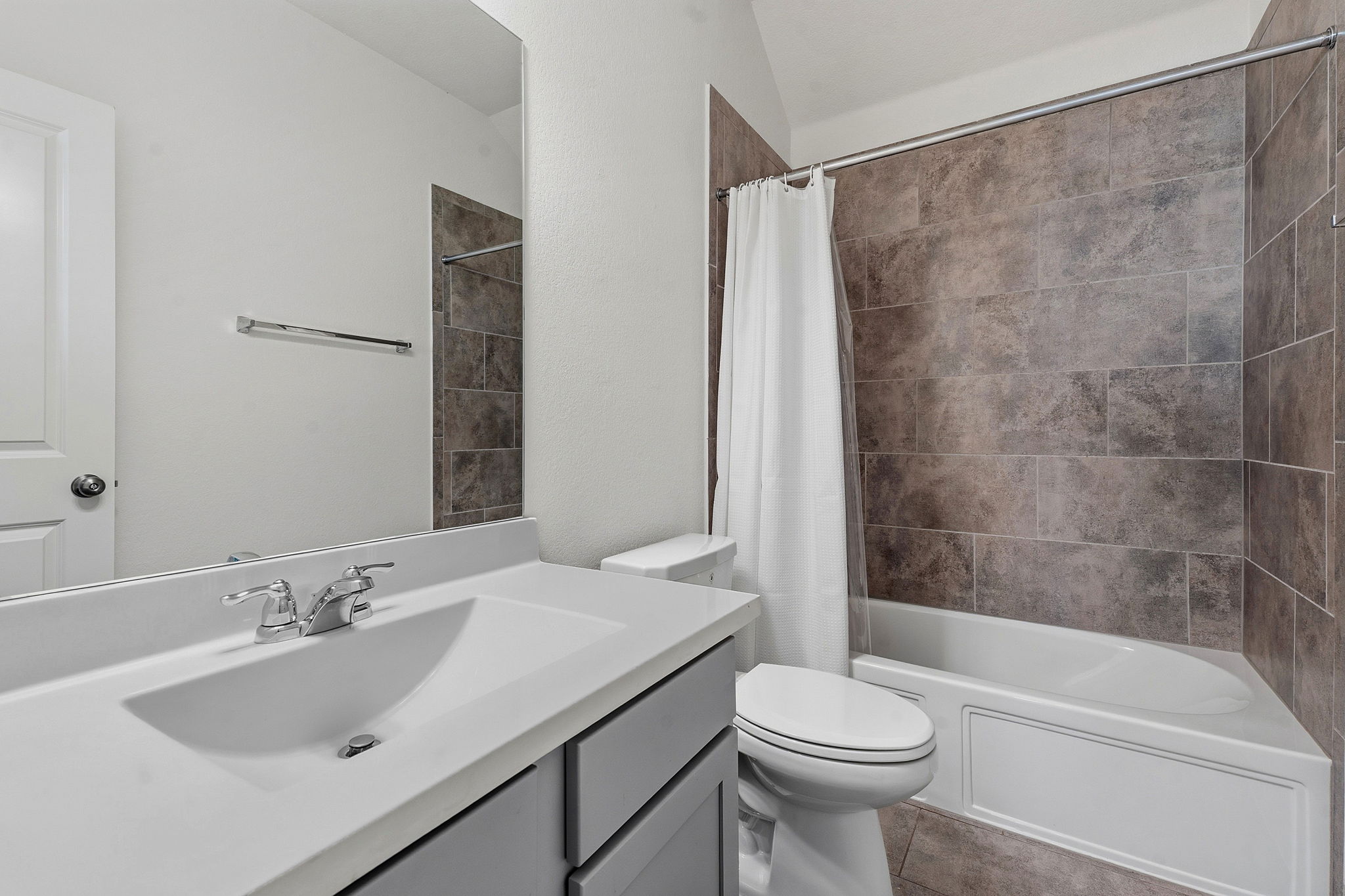 609 Allende Bend, Unit 130 Austin, TX 78748 - Photo 29 of 33 a bathroom with a sink toilet and shower