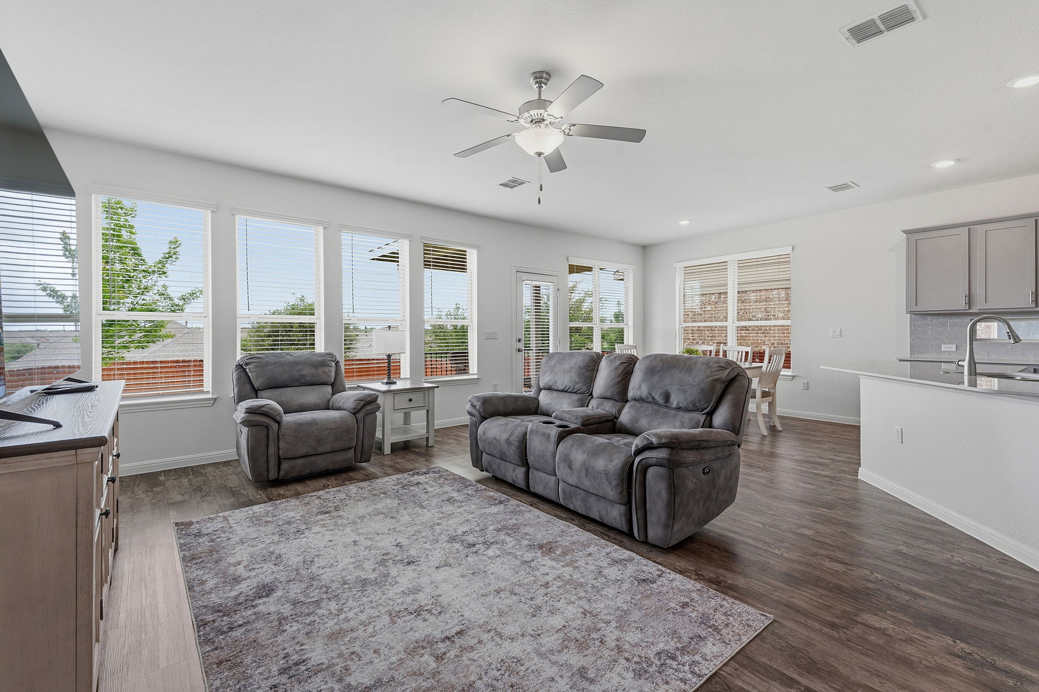 609 Allende Bend, Unit 130 Austin, TX 78748 - Photo 4 of 33 a living room with furniture or couches and a large window