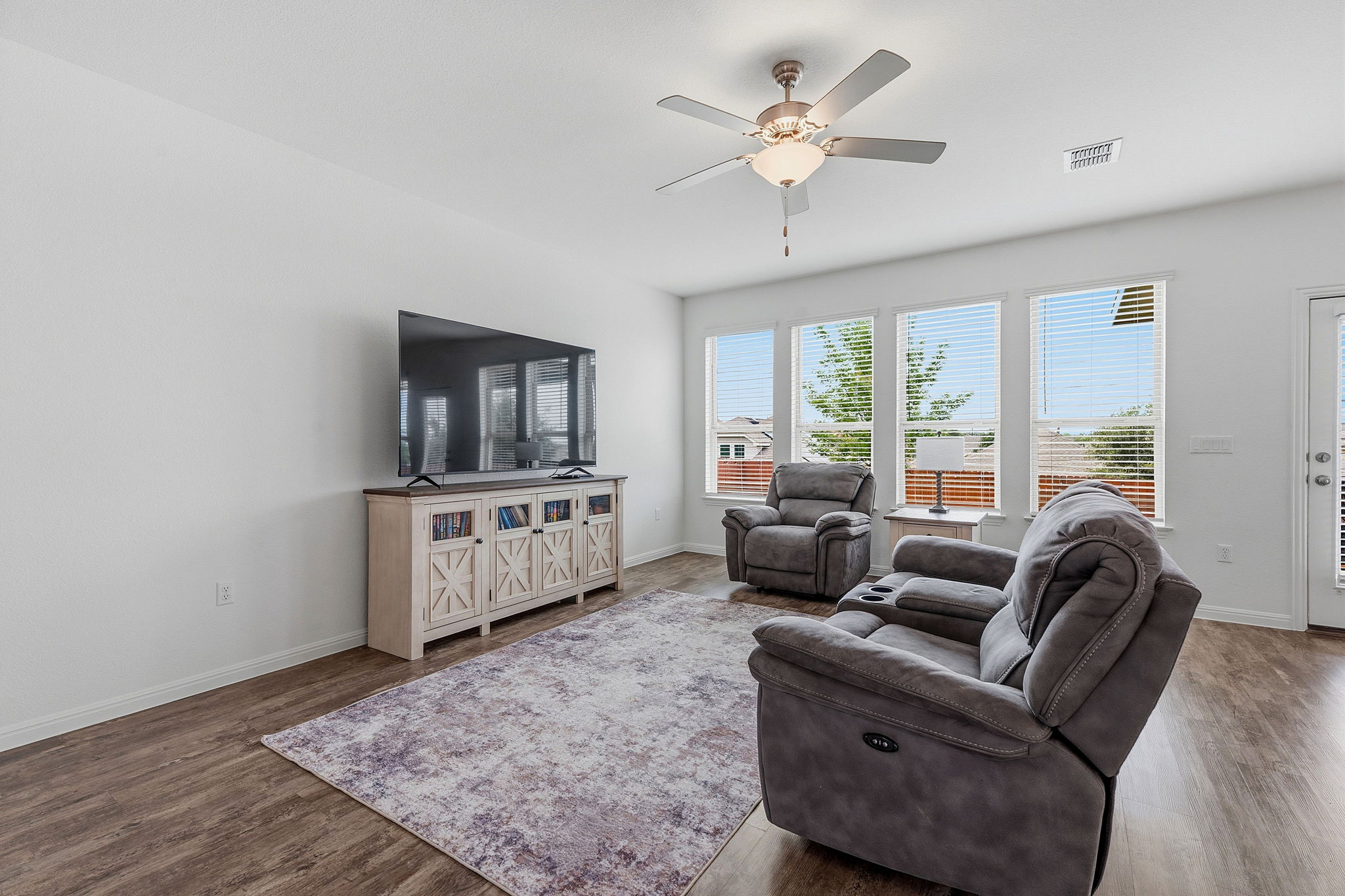 609 Allende Bend, Unit 130 Austin, TX 78748 - Photo 5 of 33 a living room with furniture and a flat screen tv