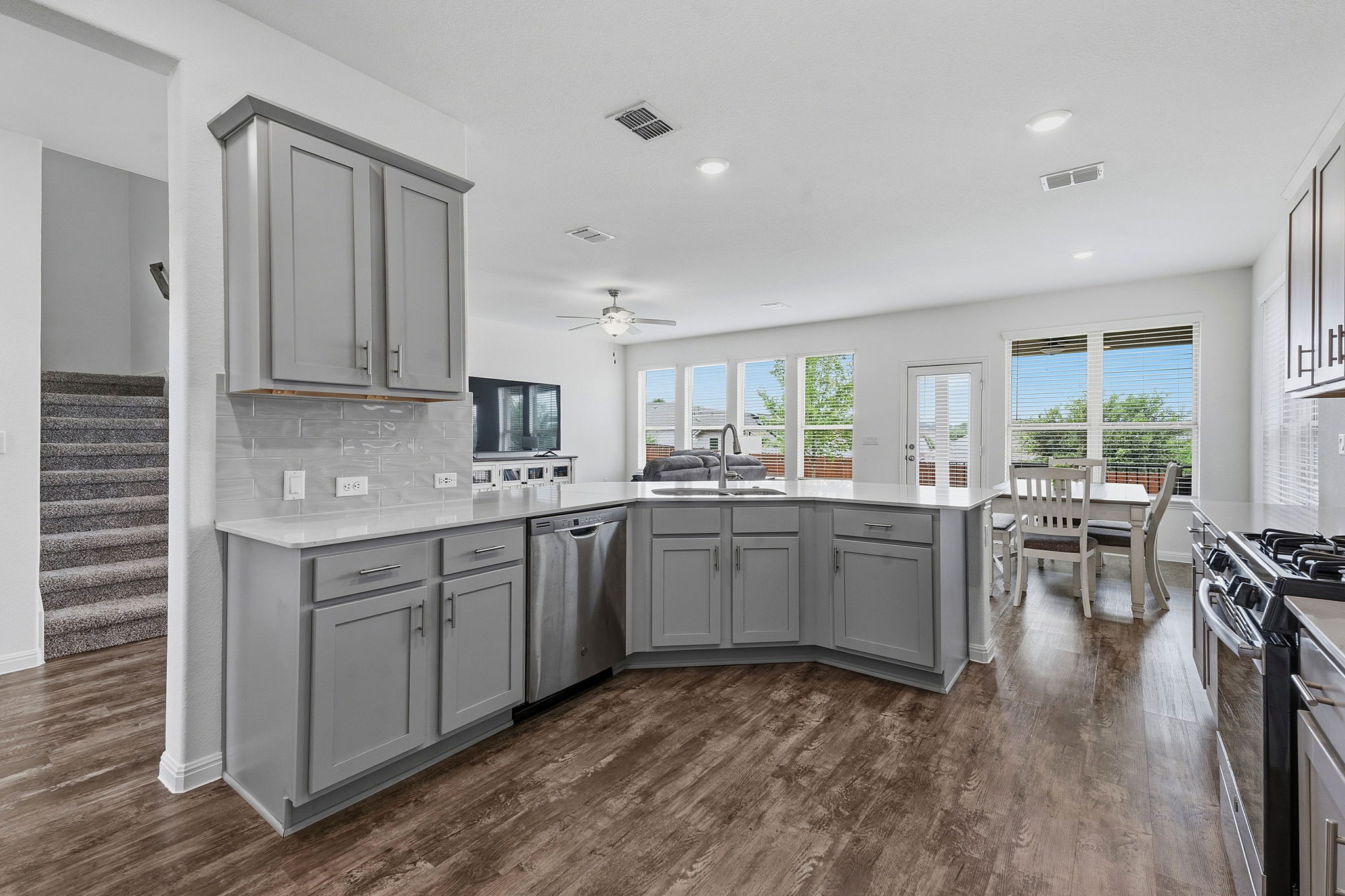 609 Allende Bend, Unit 130 Austin, TX 78748 - Photo 10 of 33 a kitchen with sink cabinets and wooden floor