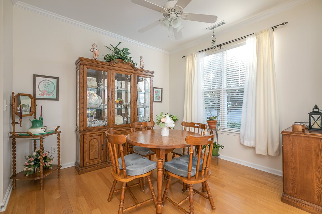 Separate dining room with hardwoods and crown molding. Dining Room