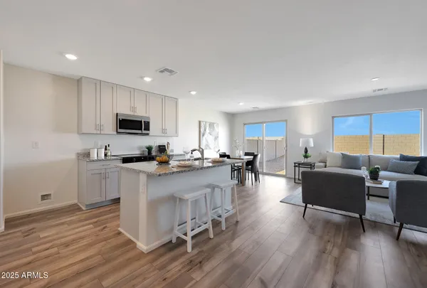 a view of kitchen with cabinets and wooden floor