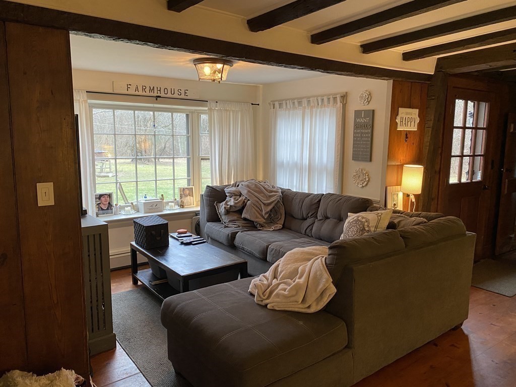 54 Northbridge Road Mendon, MA 01756 - Photo 12 of 39 a living room with furniture and a window