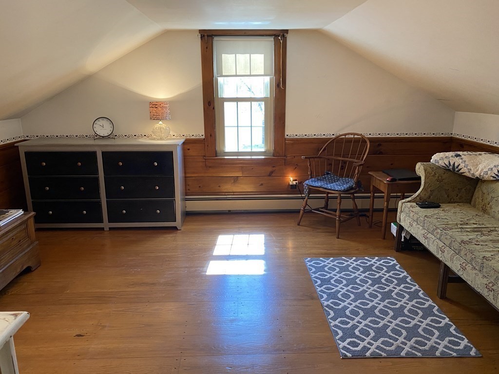54 Northbridge Road Mendon, MA 01756 - Photo 24 of 39 a living room with furniture and a rug