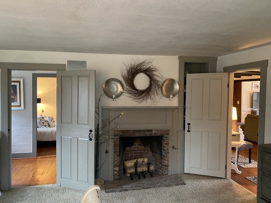 54 Northbridge Road Mendon, MA 01756 - Photo 4 of 39 a living room with furniture and a fireplace