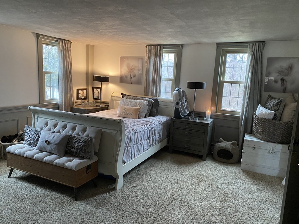 54 Northbridge Road Mendon, MA 01756 - Photo 5 of 39 a bedroom with a bed a couch and dresser