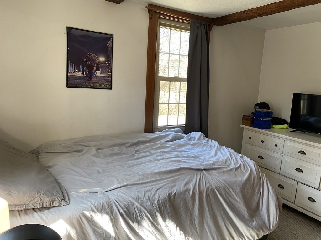54 Northbridge Road Mendon, MA 01756 - Photo 10 of 39 a bedroom with a bed and a window
