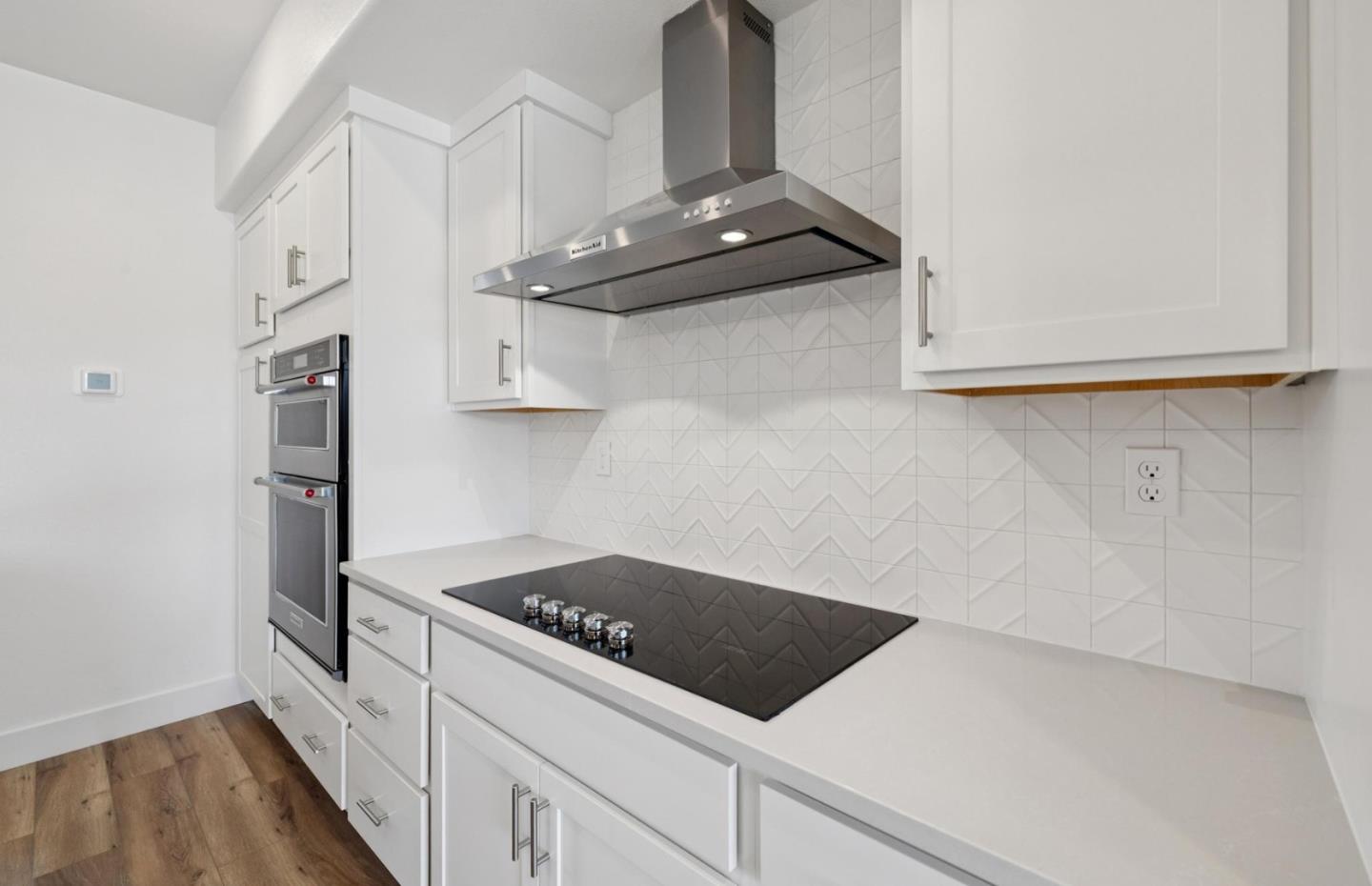 1357 Lilac Way Milpitas, CA 95035 - Photo 24 of 62 a kitchen with stainless steel appliances a stove and a refrigerator