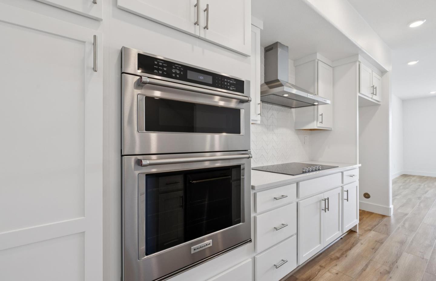 1357 Lilac Way Milpitas, CA 95035 - Photo 26 of 62 a kitchen with stainless steel appliances a stove microwave and cabinets