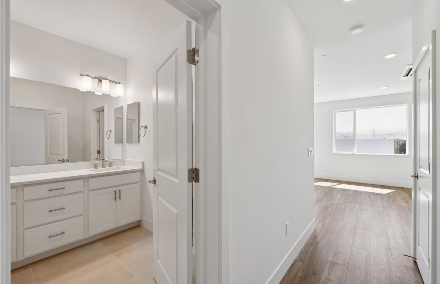 1357 Lilac Way Milpitas, CA 95035 - Photo 41 of 62 a bathroom with a double vanity sink and mirror
