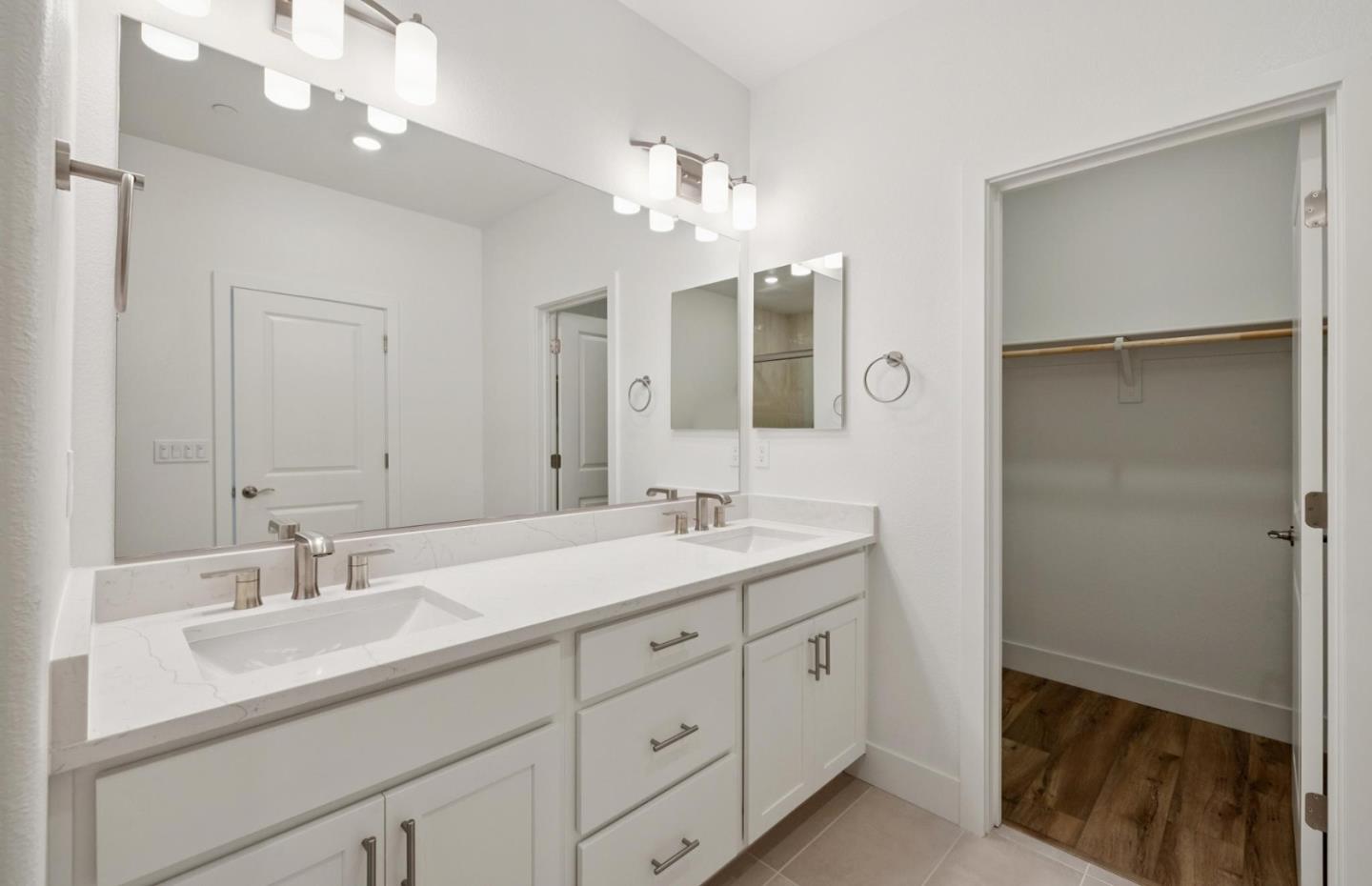 1357 Lilac Way Milpitas, CA 95035 - Photo 43 of 62 a bathroom with a double vanity sink and a mirror