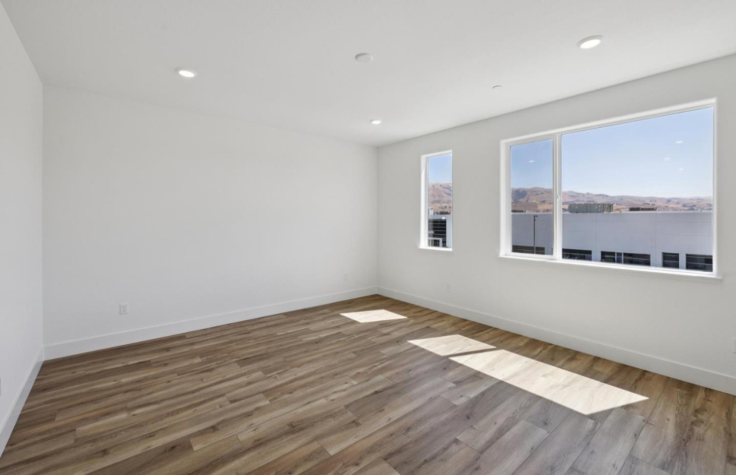 1357 Lilac Way Milpitas, CA 95035 - Photo 50 of 62 a view of an empty room with wooden floor and a window