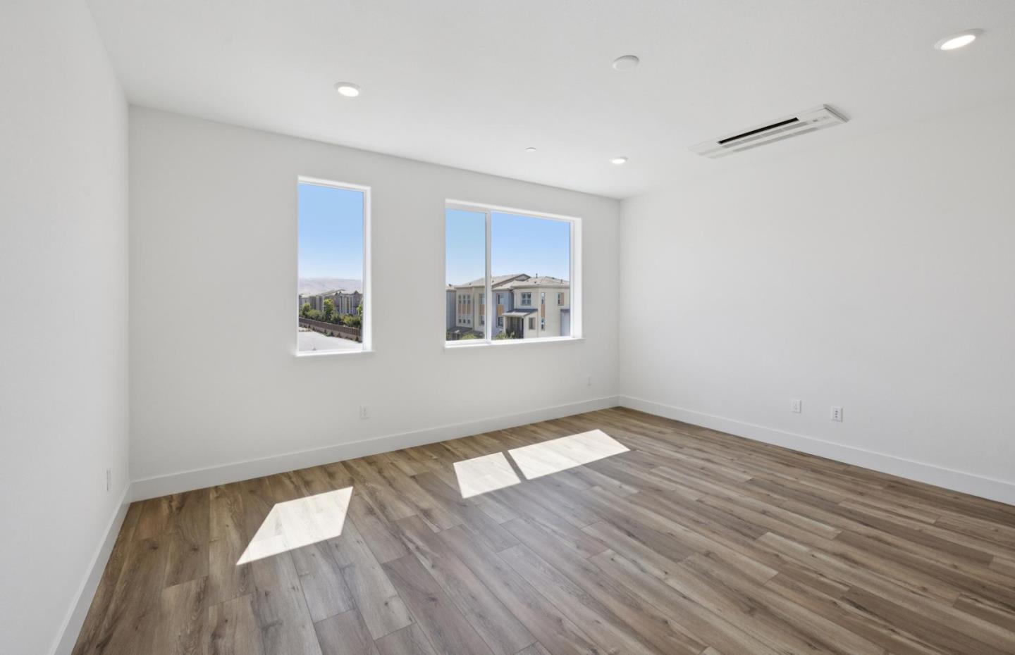 1357 Lilac Way Milpitas, CA 95035 - Photo 51 of 62 an empty room with wooden floor and windows