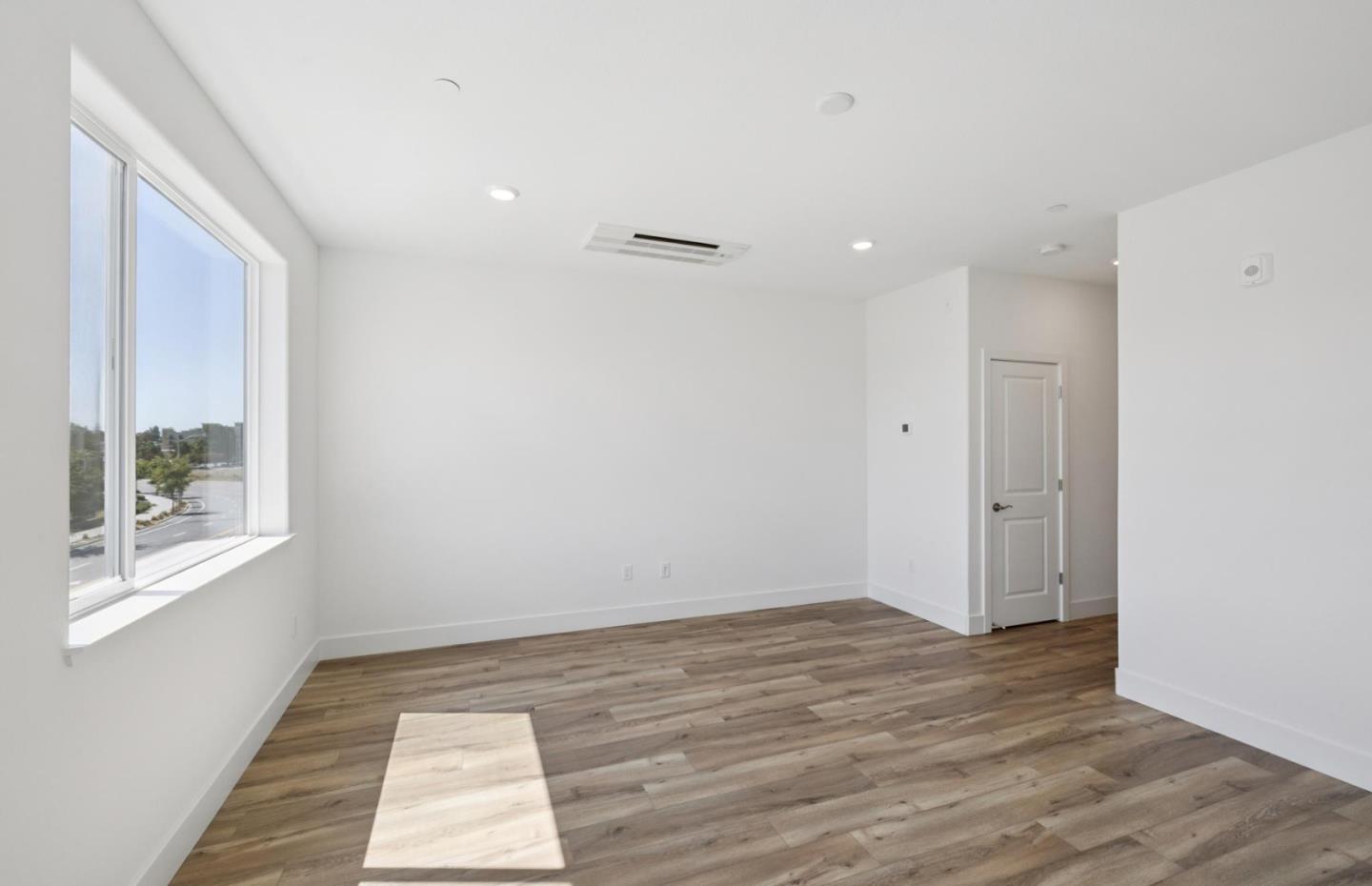 1357 Lilac Way Milpitas, CA 95035 - Photo 52 of 62 a view of an empty room with wooden floor and a window