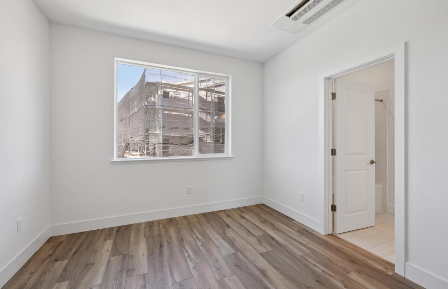 1357 Lilac Way Milpitas, CA 95035 - Photo 56 of 62 an empty room with wooden floor and windows
