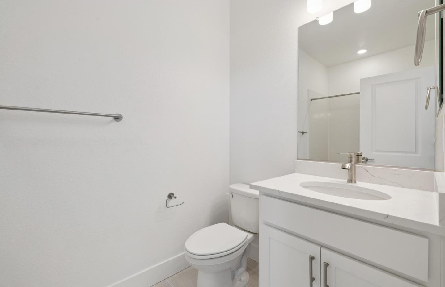 1357 Lilac Way Milpitas, CA 95035 - Photo 58 of 62 a bathroom with a toilet sink and mirror