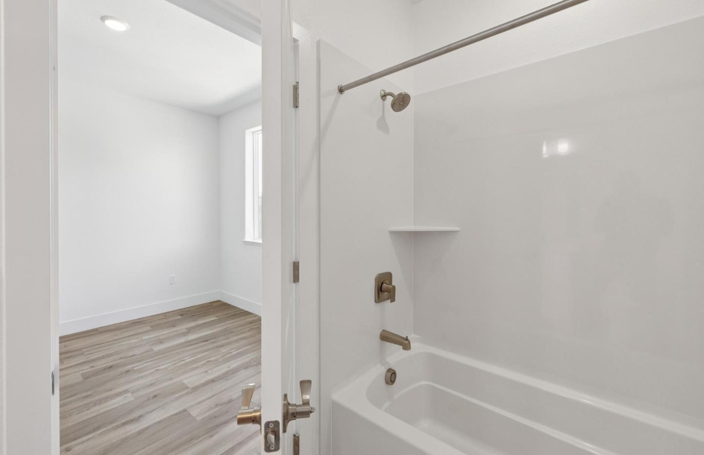 1357 Lilac Way Milpitas, CA 95035 - Photo 59 of 62 a bathroom with a bathtub and a shower