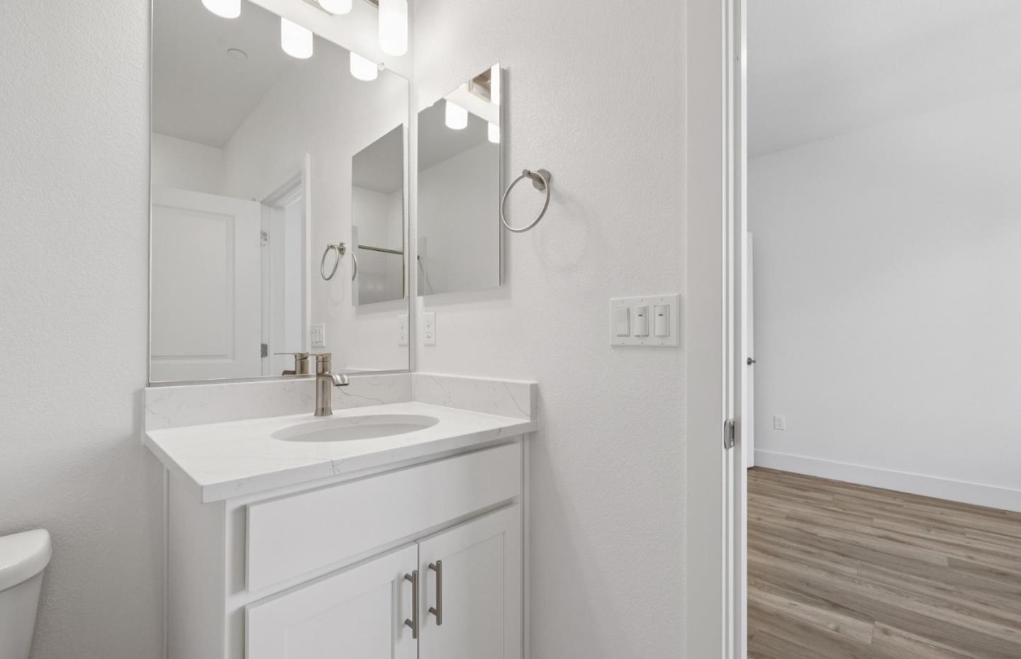 1357 Lilac Way Milpitas, CA 95035 - Photo 60 of 62 a bathroom with a sink and a mirror