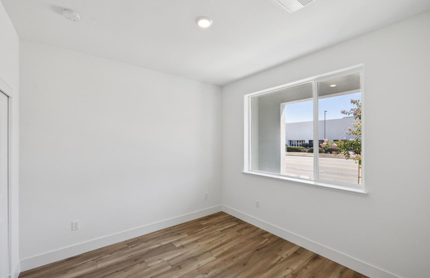 1357 Lilac Way Milpitas, CA 95035 - Photo 10 of 62 an empty room with wooden floor and a window