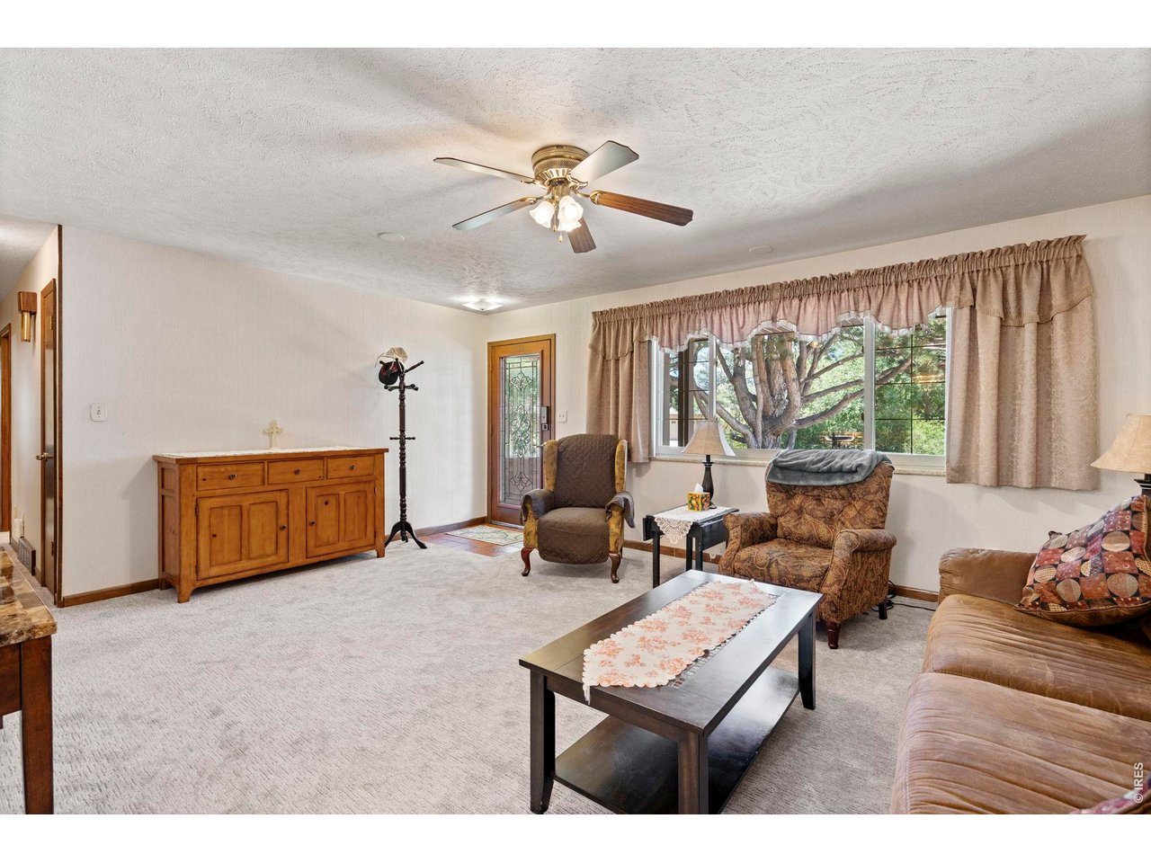 300 Ranch Acres Drive Loveland, CO 80538 - Photo 6 of 38 a living room with furniture and a window