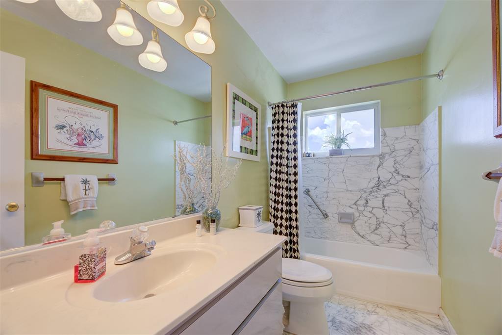 1815 North Surf Road, Unit 403 Hollywood, FL 33019 - Photo 12 of 28 a bathroom with a sink a toilet and shower