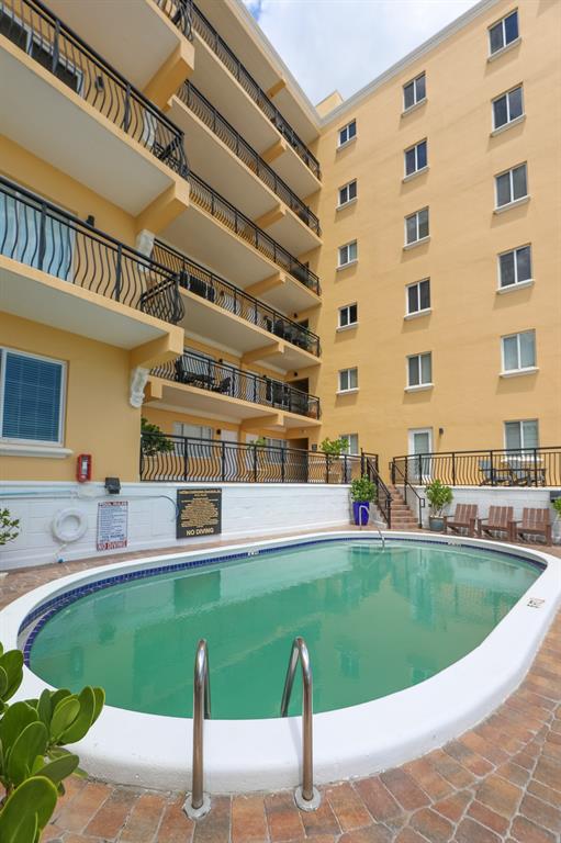 1815 North Surf Road, Unit 403 Hollywood, FL 33019 - Photo 20 of 28 a view of a swimming pool with a outdoor seating