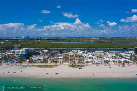 a view of a lake with houses in the back