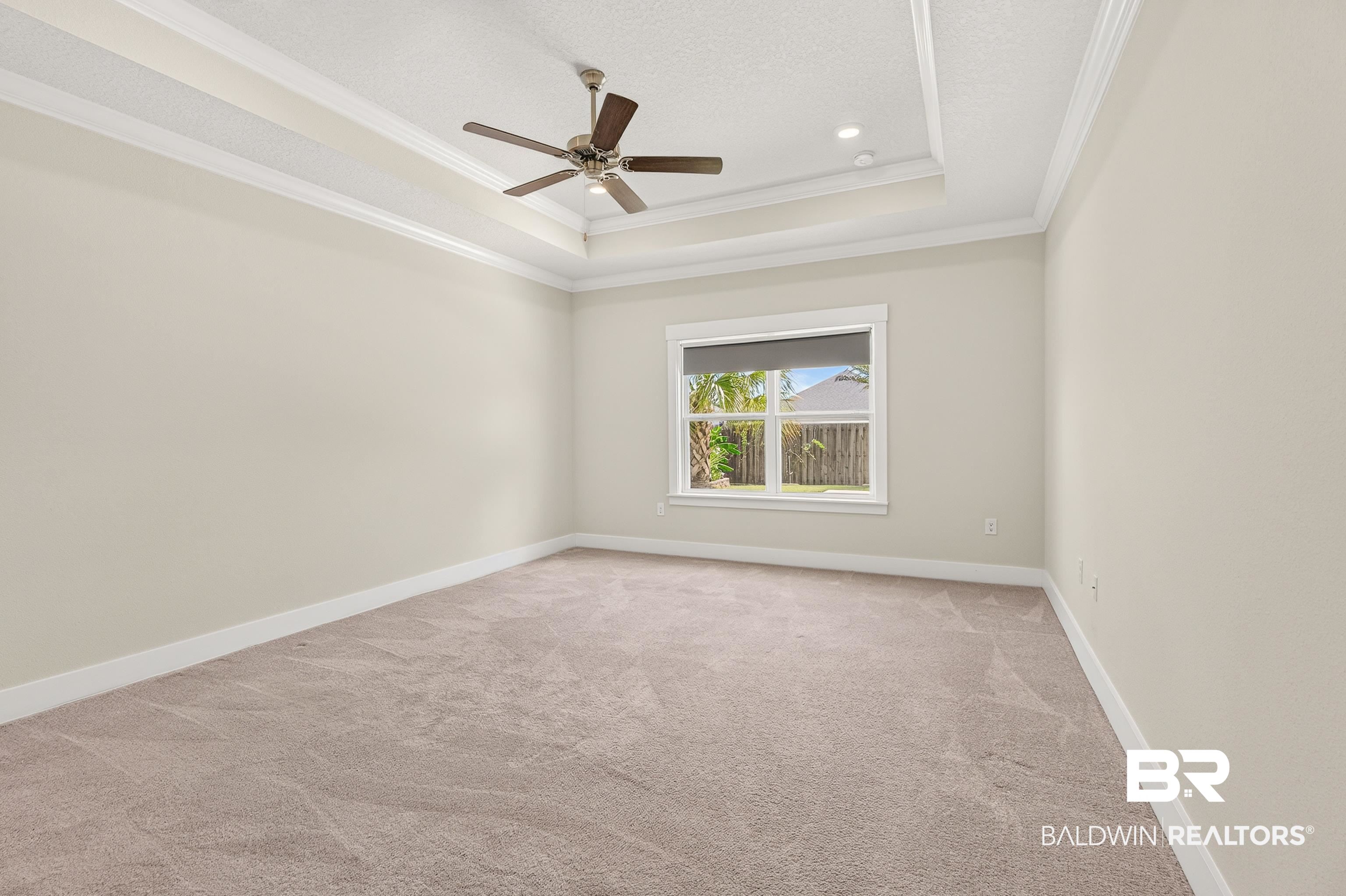 1724 Partridge Street Foley, AL 36535 - Photo 25 of 62 Spacious room featuring a tray ceiling with recessed lighting and a ceiling fan