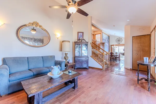 a bedroom with furniture and a wooden floor