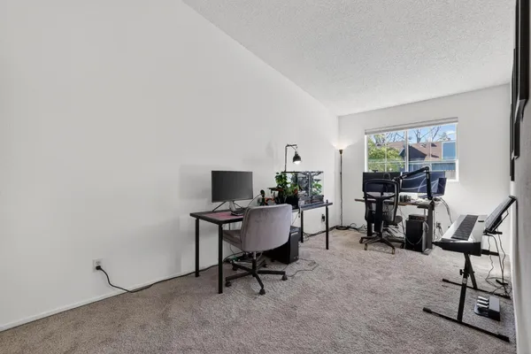 a view of a workspace with furniture