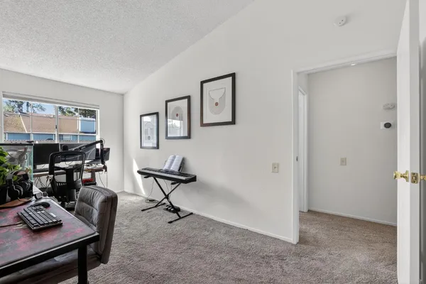 a view of a workspace with furniture