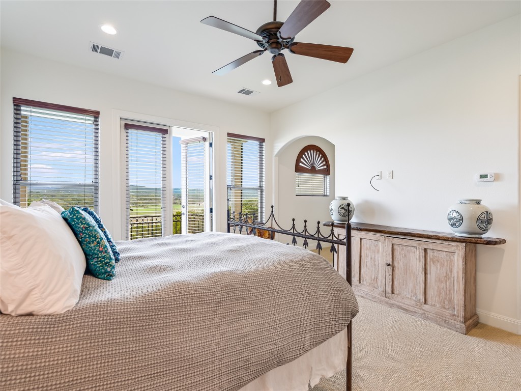 17545 West Reed Park Road, Unit 5 Jonestown, TX 78645 - Photo 15 of 26 a view of a bedroom with furniture and windows