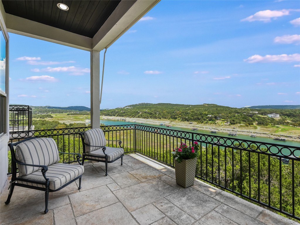 17545 West Reed Park Road, Unit 5 Jonestown, TX 78645 - Photo 2 of 26 a balcony with chairs