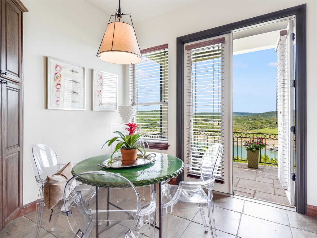 17545 West Reed Park Road, Unit 5 Jonestown, TX 78645 - Photo 9 of 26 a dining room with furniture and window