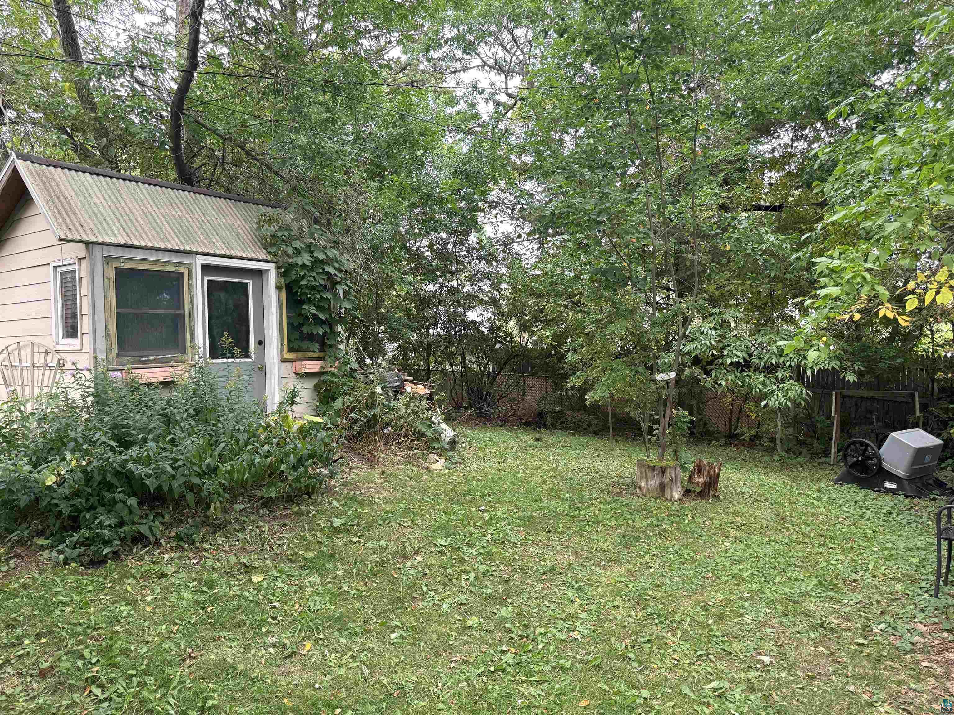 33 Riverside Drive Duluth, MN 55808 - Photo 3 of 25 View of yard with an outbuilding