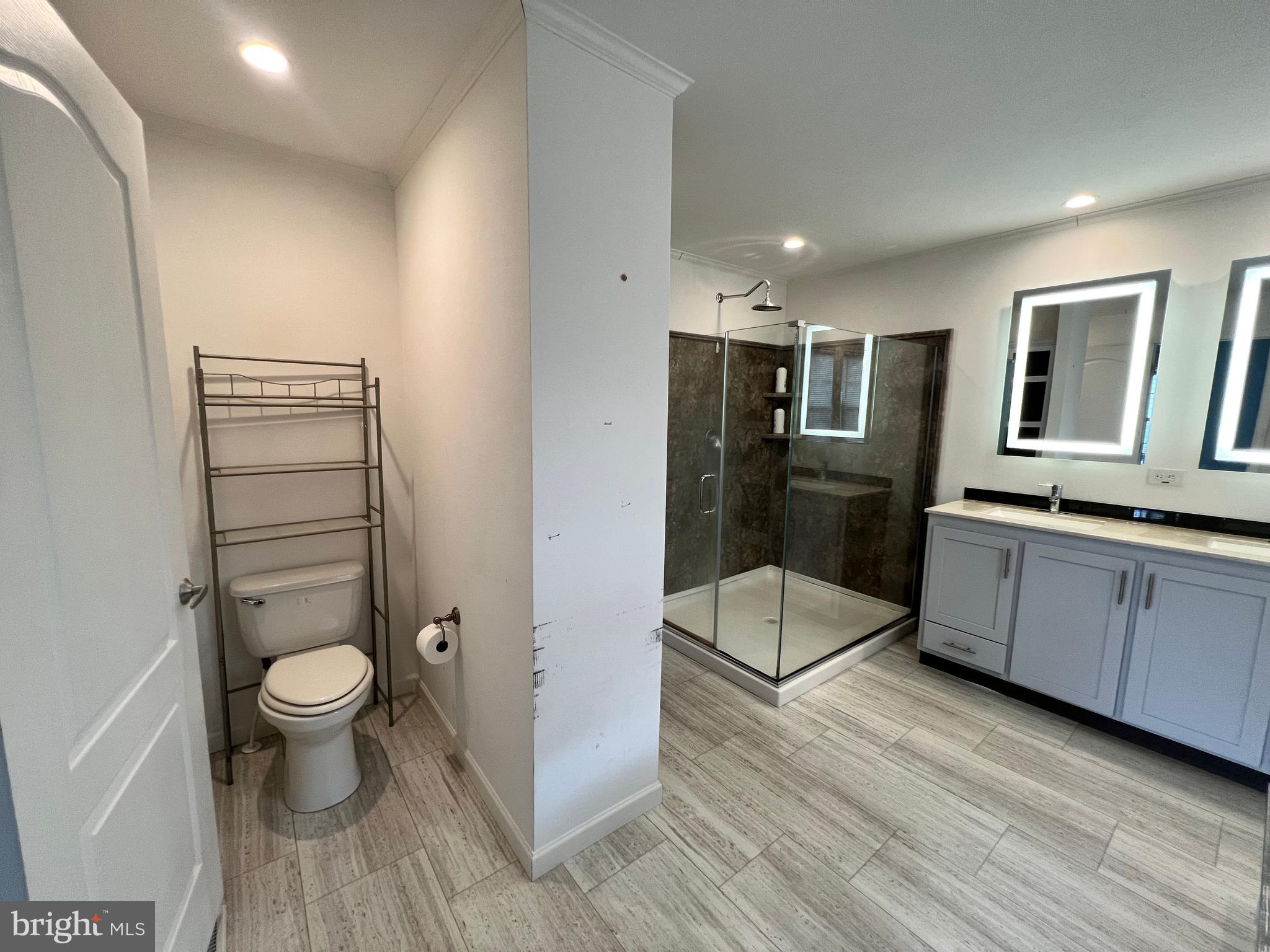 485 Keith Court Lothian, MD 20711 - Photo 14 of 23 a bathroom with a sink toilet and shower