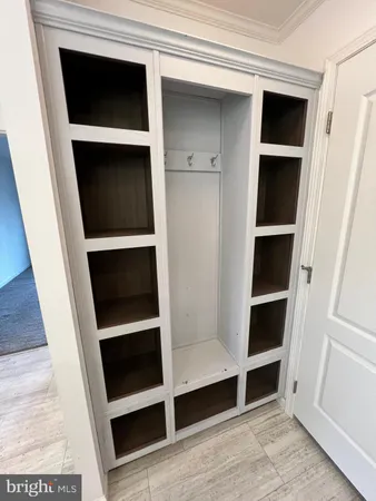 a view of closet with white door