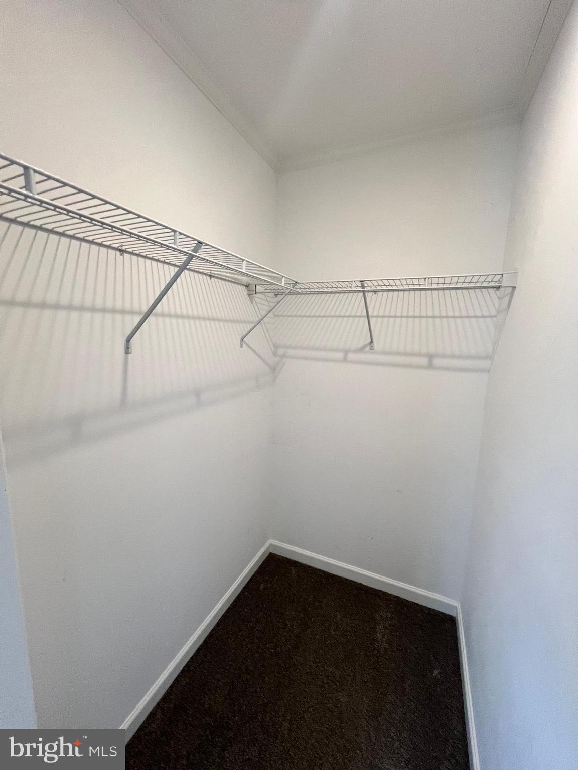 485 Keith Court Lothian, MD 20711 - Photo 9 of 23 a view of a room with racks on the wall
